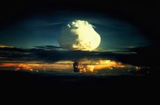 A large mushroom cloud in a blue and orange sky. Operation Ivy Hydrogen Bomb Test in Marshall Islands. 