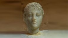 a bust of a woman, possibly Cleopatra